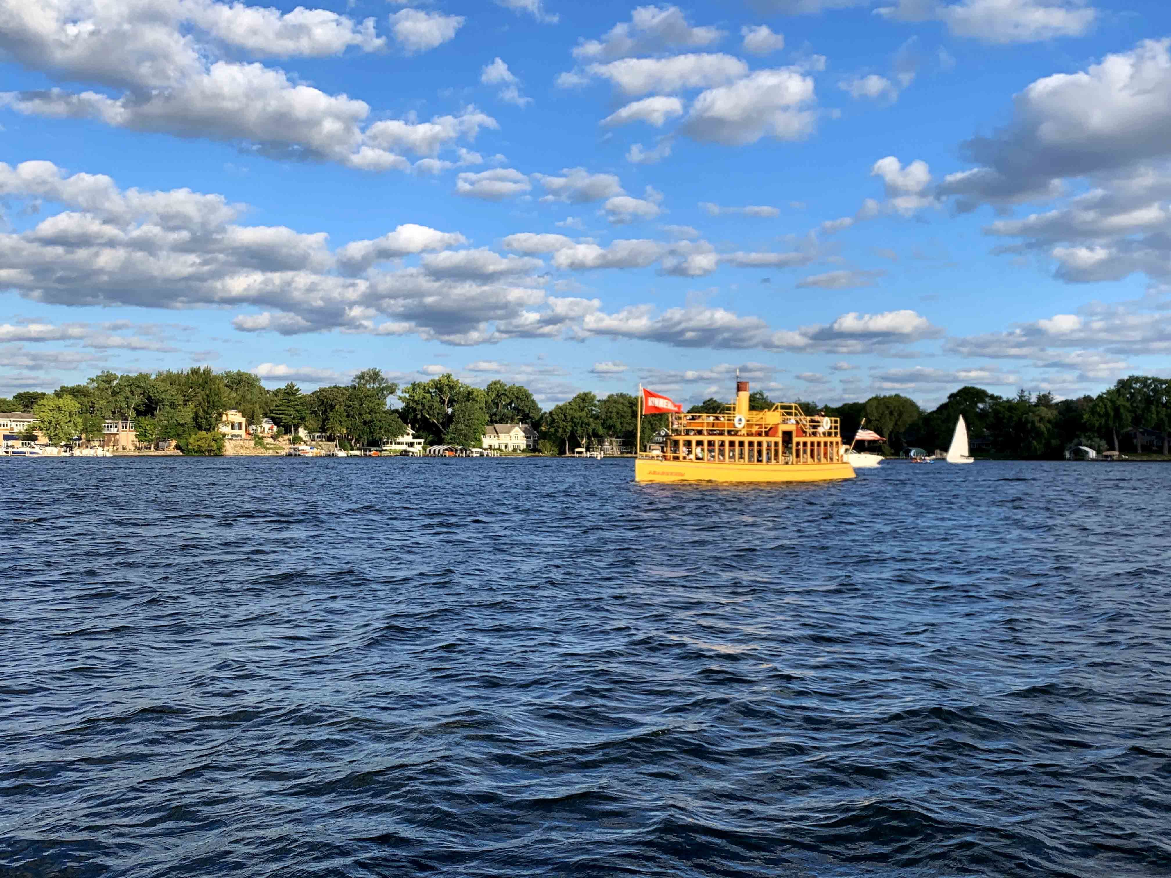 Lake Minnetonka, the largest lake in Hennepin County, offers amazing luxury homes for sale on the shores of the lake. Image of Minnehaha Steamboat on Lake Minnetonka.